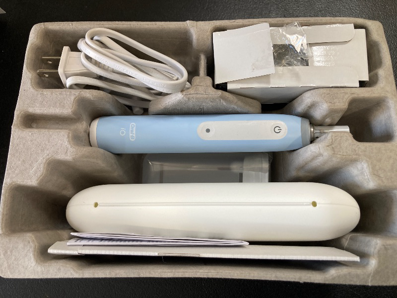 Photo 1 of Oral-B iO Deep Clean Rechargeable Electric Powered Toothbrush, Icy Blue with iO Series 3 Limited, 2 Brush Heads and Travel Case - Pressure Sensor to Protect Gums - 3 Cleaning Settings - 2 Minute Timer