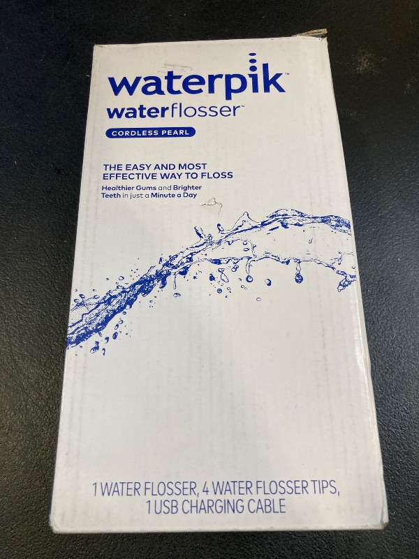 Photo 1 of Waterpik Cordless Pearl Rechargeable Portable Water Flosser for Teeth, Gums, Braces Care and Travel with 4 Flossing Tips - ADA Accepted, WF-13 Black, Packaging May Vary