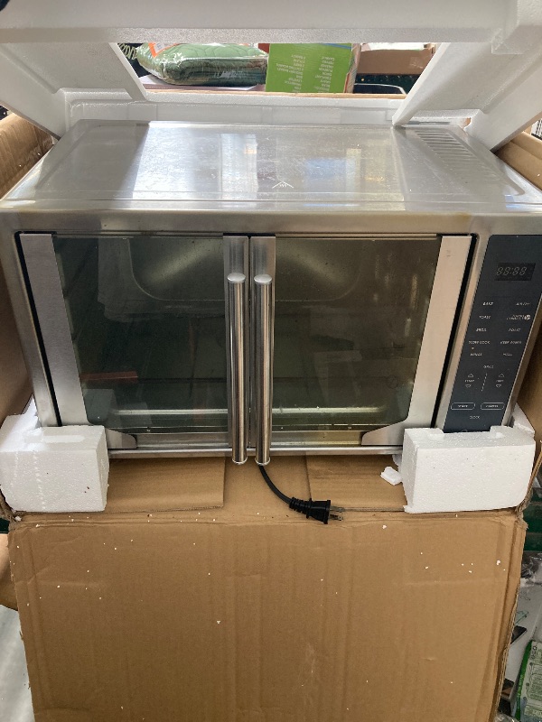 Photo 1 of Oster Air Fryer Oven 10-in-1 Countertop Toaster Large Enough for 2 Pizzas Stainless Steel French Doors XL Sized
