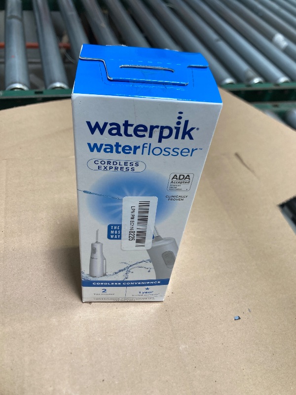 Photo 1 of Waterpik Cordless Express Water Flosser, Battery Operated & Portable for Travel & Home, ADA Accepted, Waterproof for Shower Use, White WF-02, Packaging May Vary