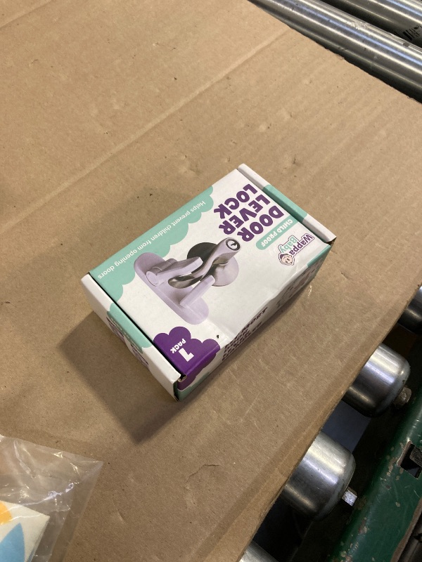 Photo 1 of Door Lever Lock (1 Pack) Prevents Toddlers from Opening Doors. 3.25" L * 1.5" W * 4.5" H Easy One Hand Operation for Adults. Durable ABS with 3M Adhesive Backing. Simple Install, No Tools Needed.