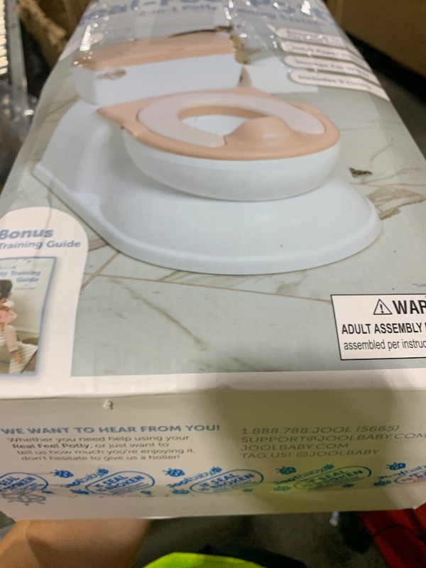 Photo 1 of Real Feel 2-in-1 Potty with Wipes Storage, Flushing Sounds & Disposable Liners - Realistic Toilet - Easy to Clean & Assemble - Jool Baby (Pink)