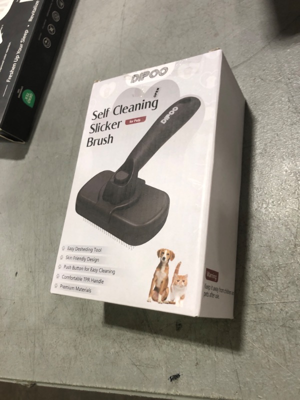 Photo 1 of Dipoo Self Cleaning Shedding Brush - Skin Friendly Grooming Tool for Dogs, Cats, and Puppies, Deshedding and Hair Removal for Long and Short Haired Pets, Black