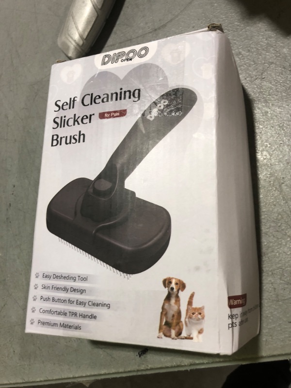 Photo 1 of Dipoo Self Cleaning Shedding Brush - Skin Friendly Grooming Tool for Dogs, Cats, and Puppies, Deshedding and Hair Removal for Long and Short Haired Pets, Black