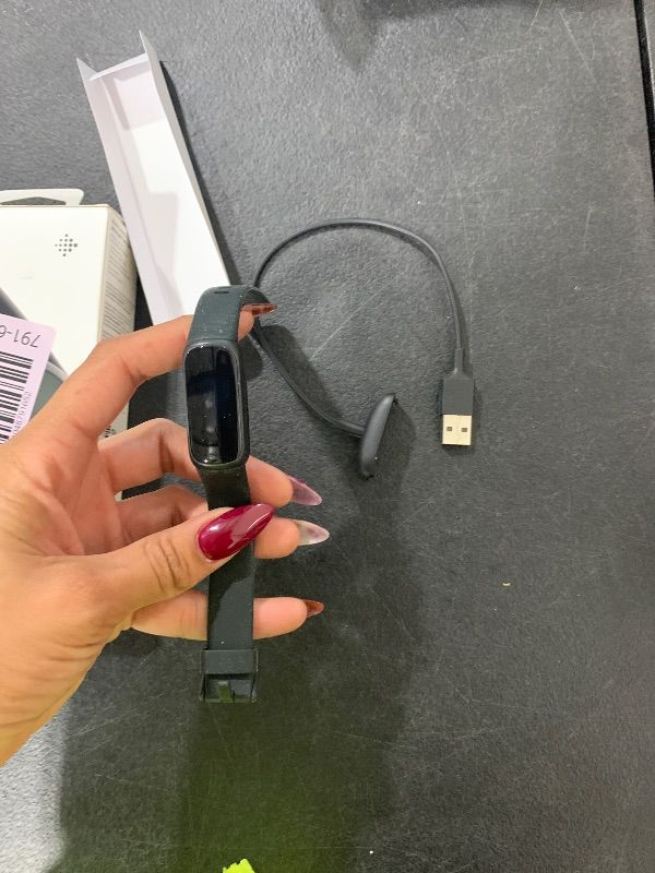 Photo 1 of ITEM IS MISSING PARTS, UNSURE WHAT PARTS ARE MISSING --------------------------------------Fitbit Inspire 3 Health &-Fitness-Tracker with Stress Management, Workout Intensity, Sleep Tracking, 24/7 Heart Rate and more, Midnight Zen/Black One Size (S & L Ba
