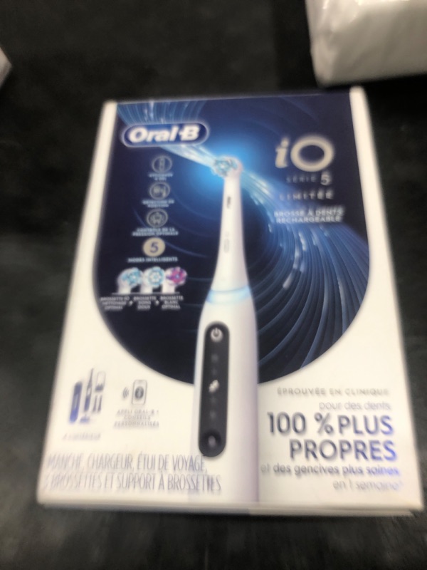 Photo 1 of Oral-B iO Deep Clean + Whiten Rechargeable Electric Toothbrush with Visible Pressure Sensor, 2 Minute Timer, 5 Cleaning Settings, 1 iO5 Limited, 3 Toothbrush Heads, Travel Case & Refill Holder, White