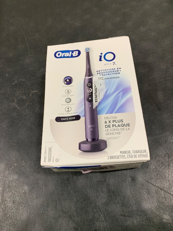 Photo 1 of Oral-B iO Deep Clean + Protect Rechargeable Electric Toothbrush, Black with a iO Series 7 Toothbrush, 2 Replacement Brush Heads, and a Charging Travel Case