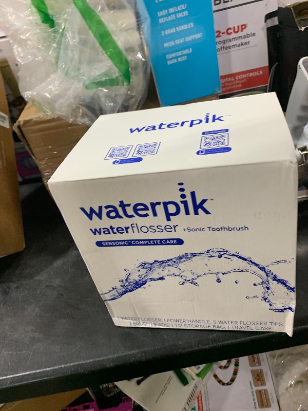 Photo 1 of Waterpik Sensonic Complete Care Water Flosser and Rechargeable Electric Toothbrush Combo Set for Teeth Cleaning and Flossing, CC-04, White, Packaging May Vary