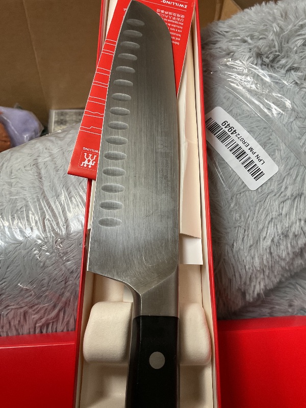 Photo 1 of ZWILLING Professional S 7-inch Razor-Sharp German Hollow Edge Santoku Knife, Made in Company-Owned German Factory with Special Formula Steel perfected for almost 300 Years, Dishwasher Safe