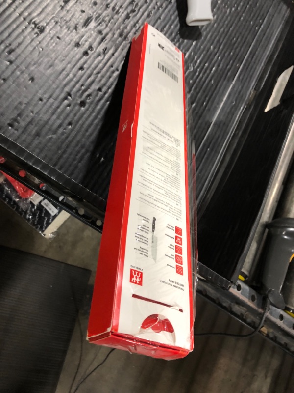 Photo 1 of ZWILLING Professional S 7-inch Razor-Sharp German Hollow Edge Santoku Knife, Made in Company-Owned German Factory with Special Formula Steel perfected for almost 300 Years, Dishwasher Safe