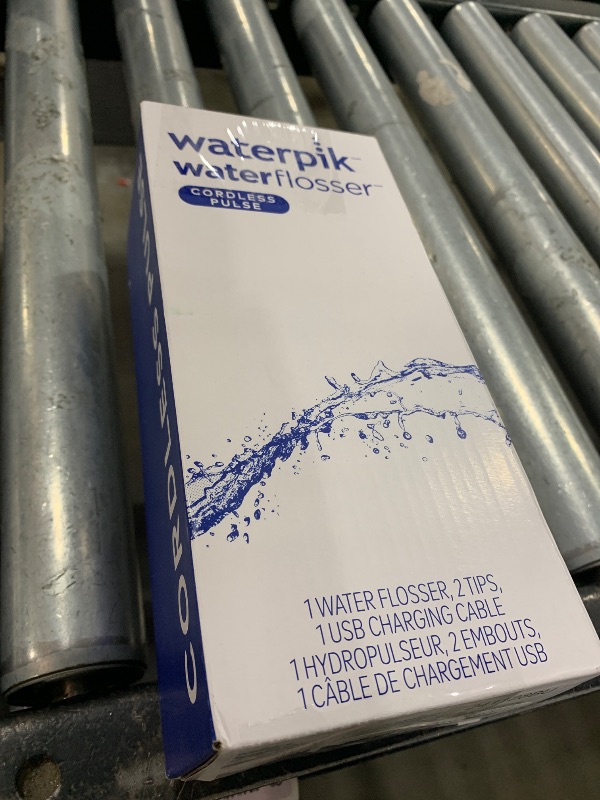 Photo 1 of Waterpik Cordless Pulse Rechargeable Portable Water Flosser for Teeth, Gums, Braces Care and Travel with 2 Flossing Tips, Waterproof, ADA Accepted, WF-20 Blue, Packaging May Vary