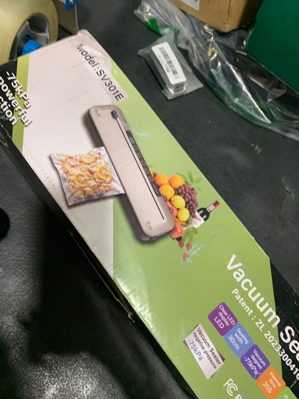 Photo 1 of 75Kpa Vacuum Sealer,6-in-1 Food Sealer for Freshness Storage,with Digital Timer, Moist/Dry Modes, Built-in Cutter & 10 Vacuum Bags (silver)