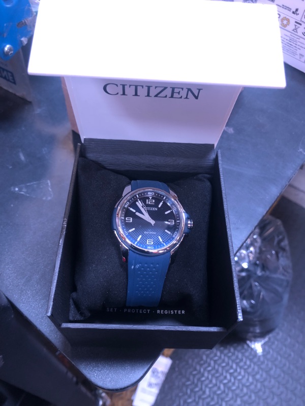 Photo 2 of Citizen Men's Eco-Drive Weekender Watch in Stainless Steel with Blue Polyurethane strap, Blue Dial (Model: AW1158-05L)