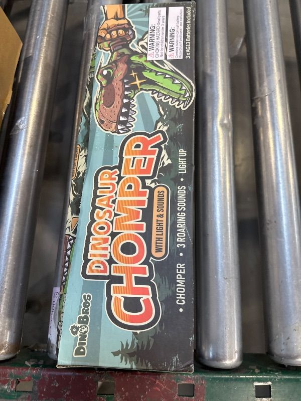 Photo 1 of DINOBROS Dinosaur Chomper Toys for Kids with 3 Roar Sounds and Light Jurassic Dinosaurs Grabber Claw T-Rex Reacher Robot Hand Pincher Dino Snapper