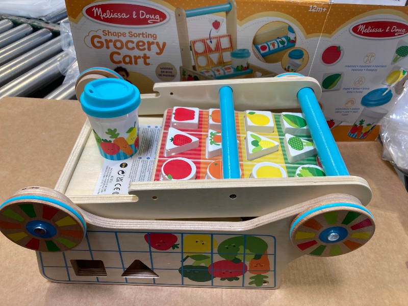 Photo 1 of Melissa & Doug Wooden Shape Sorting Grocery Cart Push Toy and Puzzles - Pretend Play Grocery Toys, Sorting And Stacking Toys For Infants And Toddlers Ages 1+ - FSC-Certified Materials