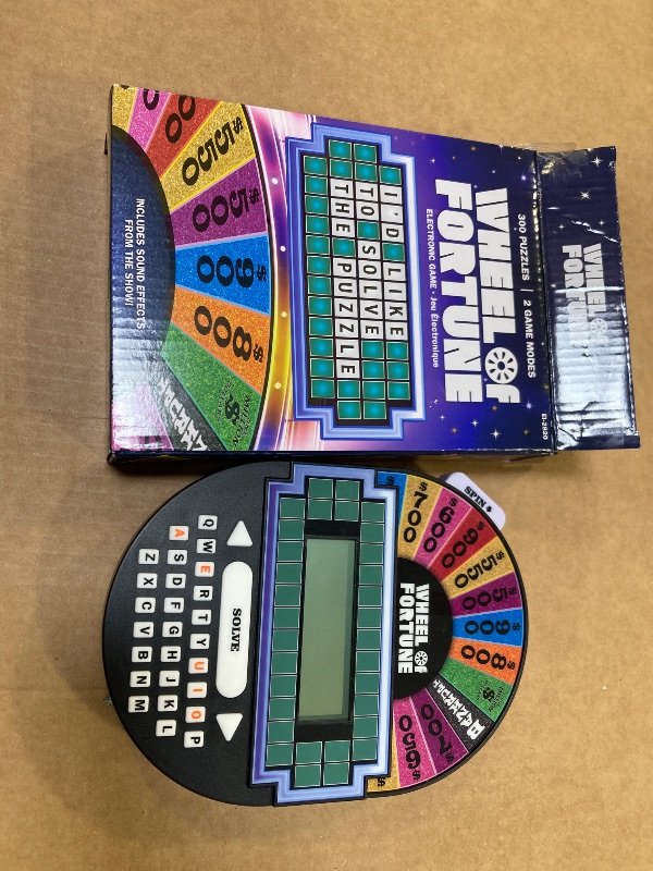 Photo 1 of Educational Insights Wheel of Fortune Game - Handheld Electronic Game, Great for Travel, Classic Retro Party Games for Kids, Teens & Adults, Word Puzzle Challenge & Entertaining Gift for Ages 8+