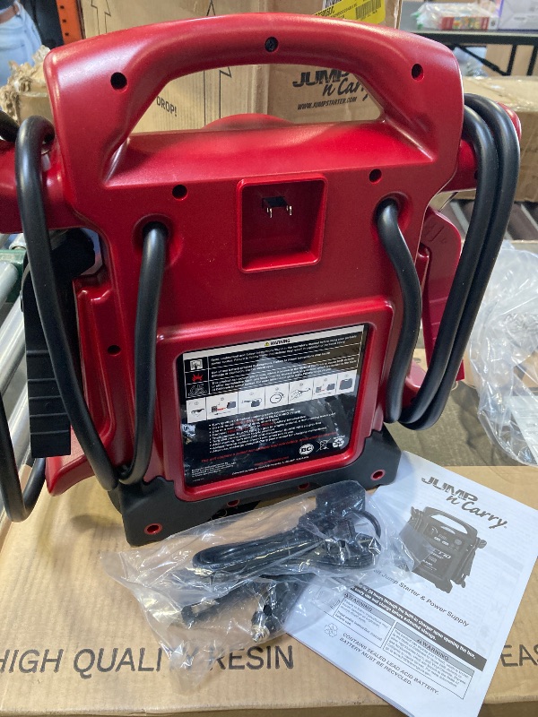 Photo 1 of Clore Automotive Jump-N-Carry JNC770R 1700 Peak Amp Premium 12 Volt Jump Starter - Red