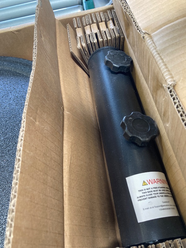 Photo 1 of Mainstays 26LB Matte Black Round Umbrella Base Designed to Be Used with a Patio Table

