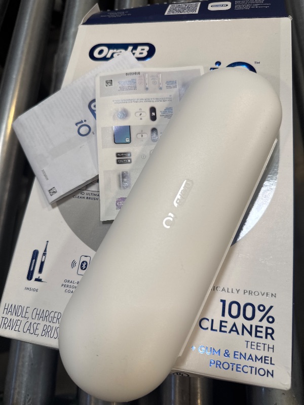 Photo 1 of Oral-B iO Series 6 Rechargeable Electric Toothbrush with Visible Pressure Sensor to Protect Gums, 2 Minute Timer, 5 Cleaning Settings, 1 Replacement Toothbrush Head, and Travel Case, Grey Opal