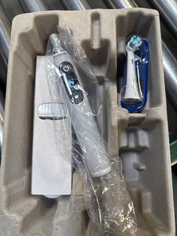 Photo 1 of Oral-B iO Series 6 Rechargeable Electric Toothbrush with Visible Pressure Sensor to Protect Gums, 2 Minute Timer, 5 Cleaning Settings, 1 Replacement Toothbrush Head, and Travel Case, Grey Opal