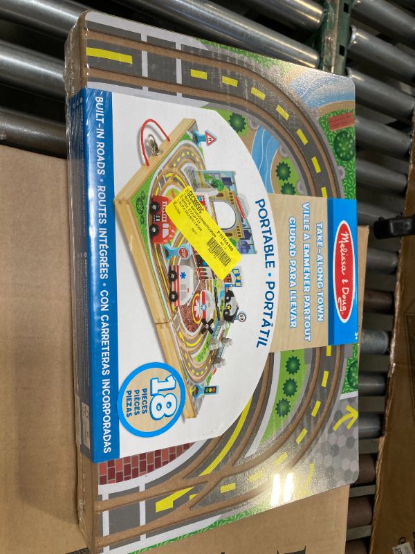 Photo 1 of Melissa & Doug 18-Piece Wooden Take-Along Tabletop Town, 4 Rescue Vehicles, Play Pieces, Bridge , 15.4 x 11.0 x 2.6