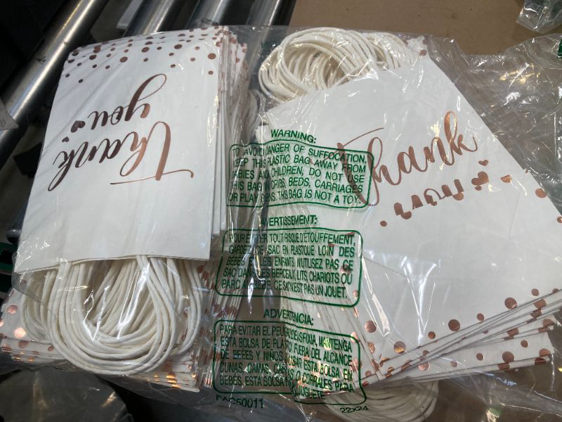 Photo 1 of "Thank You" gift bags, suitable for party favors or small gifts.
