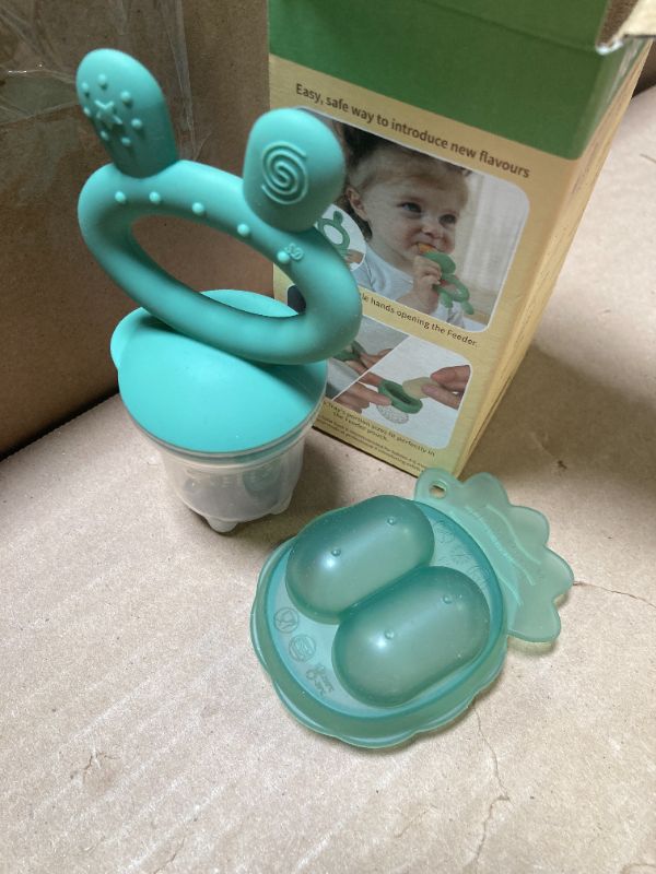 Photo 1 of Haakaa Baby Fruit Food Feeder & Mini Freezer Nibble Tray Combo, Breastmilk Popsicle Molds for Cooling Relief, BPA Free Silicone Feeder for Safe Infant Self Feeding, 4 Month+ (Pea Green)