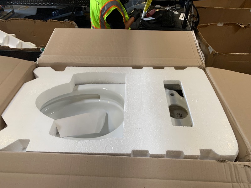 Photo 1 of TOTO Drake Two-Piece Elongated 1.28 GPF TORNADO FLUSH Toilet with CEFIONTECT, Cotton White - CST776CEG#01