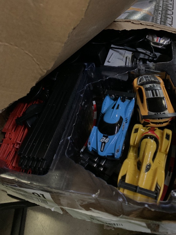 Photo 1 of Slot Car Race Track Set, 19ft Electric Track with LED Lights and 4 Slot Cars, 2 Hand Controllers and Racing Game Lap Counters, Set Features Loop, Turns, and Crossover for Boys Age 6-12