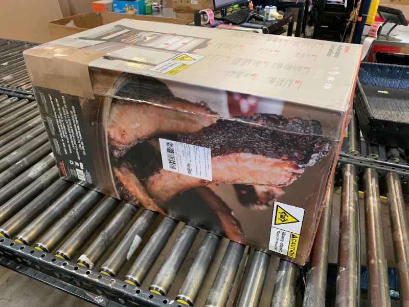 Photo 1 of Masterbuilt® 30-inch Digital Electric Vertical BBQ Smoker with Leg Kit, Side Wood Chip Loader and 710 Cooking Square Inches in Black, Model MB20070421