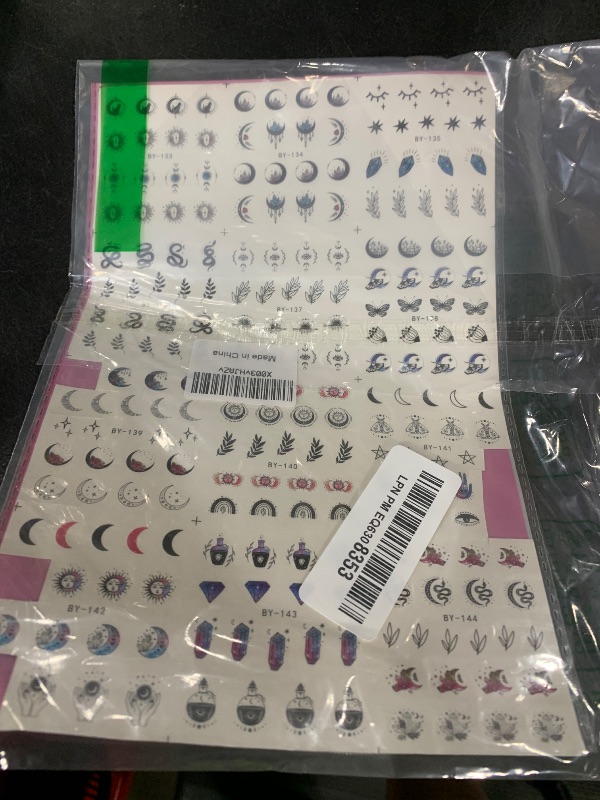Photo 1 of 12 Sheets Moon Stars Nail Art Stickers Water Transfer Slider Nail Decals Sun Eyes Snakes Black Art Design Sticker Nail Art Decorations Supplies Acrylic Nail Stickers for Women Girls Nail Art DIY