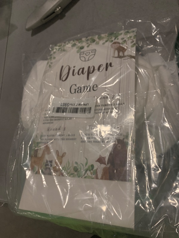 Photo 1 of Ctosree 31 Pieces Woodland Animal Baby Shower Diaper Game 1 Diaper Baby Shower Game Board 7 Diapers 10 Plastic Balls 1 Organza Bag for Bridal Games Boy Girl