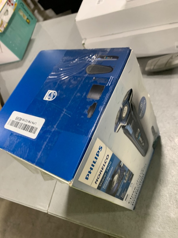 Photo 1 of Philips Norelco Shaver 7800, Rechargeable Wet & Dry Electric Shaver with SenseIQ Technology, Quick Clean Pod, Charging Stand, Travel Case and Pop-up Trimmer, S7885/85