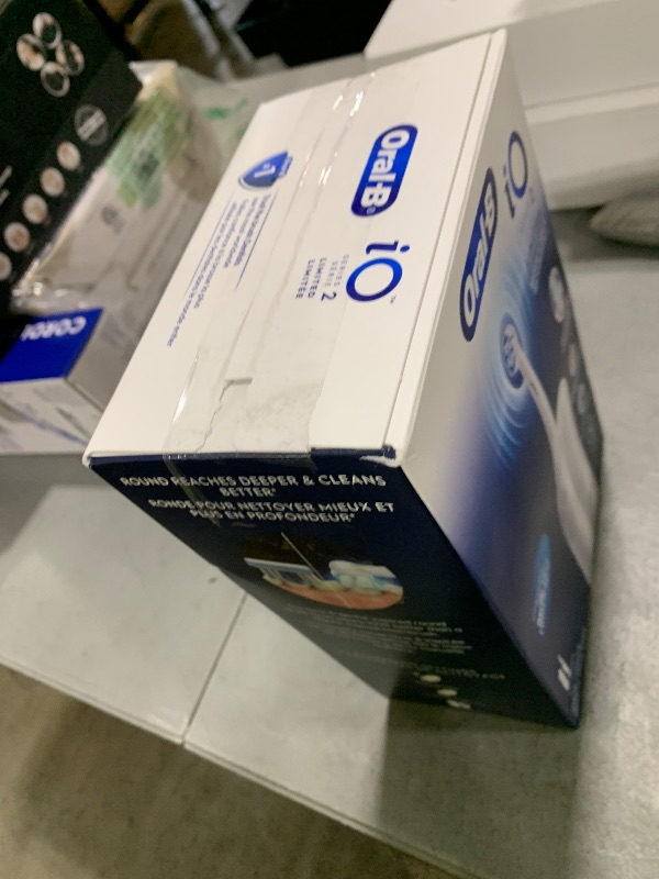 Photo 1 of Oral-B iO Simple Clean Rechargeable Electric Powered Toothbrush, Pure White with 1 Gentle Care Brush Head and 1 White Travel Case - Automatic Pressure Sensor to Protect Gums - 3 Modes -2 Min Timer