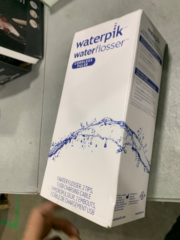 Photo 1 of Waterpik Cordless Pulse Rechargeable Portable Water Flosser for Teeth, Gums, Braces Care and Travel with 2 Flossing Tips, Waterproof, ADA Accepted, WF-20 White, Packaging May Vary