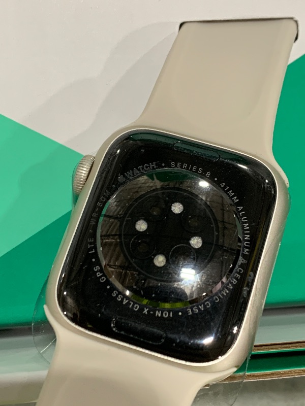 Photo 1 of Apple Watch Series 8 (GPS + Cellular, 41MM) Starlight Aluminum Case with Starlight M/L Sport Band (Renewed Premium)