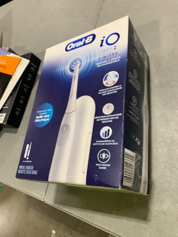 Photo 1 of Oral-B iO Simple Clean Rechargeable Electric Powered Toothbrush, Pure White with 1 Gentle Care Brush Head and 1 White Travel Case - Automatic Pressure Sensor to Protect Gums - 3 Modes -2 Min Timer