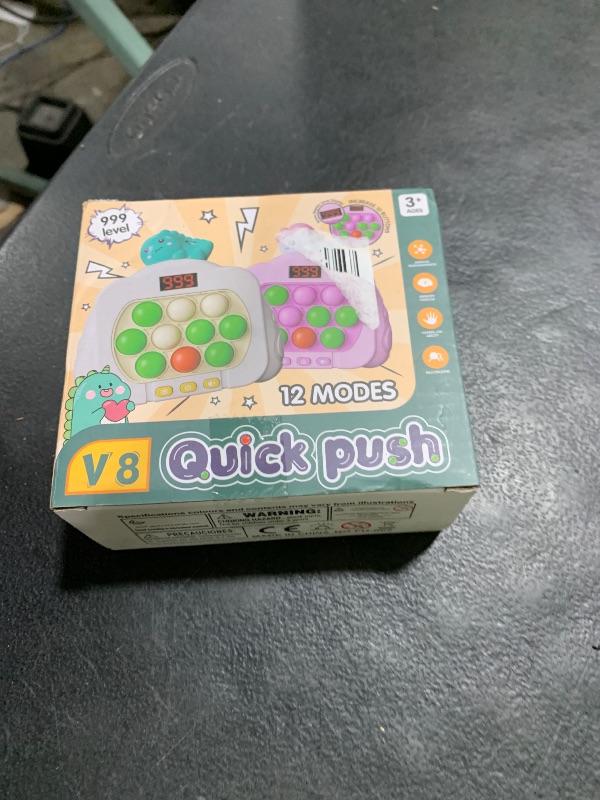 Photo 1 of Quick Push Pop Game Fidget Toys, 12 Modes LED Screen Light Up Fast Push Bubble Game, Handheld Speed Pushing Game, Christmas Toys Gifts for 6 7 8 9 10 11 12 Years Old Kids Stocking Stuffers?Dinosaur?