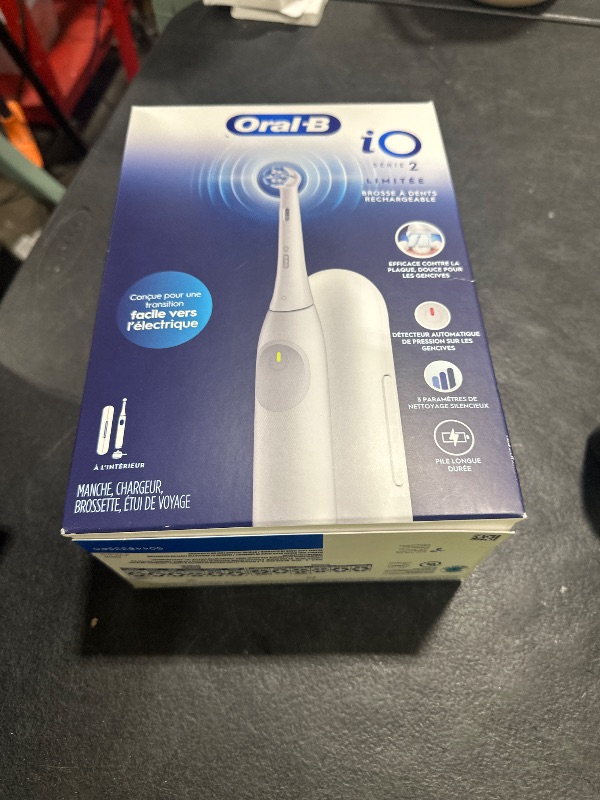 Photo 1 of Oral-B iO Simple Clean Rechargeable Electric Powered Toothbrush, Pure White with 1 Gentle Care Brush Head and 1 White Travel Case - Automatic Pressure Sensor to Protect Gums - 3 Modes -2 Min Timer
