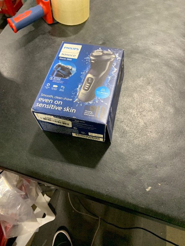 Photo 1 of Philips Norelco Shaver 3900 Series, Wet and Dry Electric Shaver, P-Cap, Travel Pouch, Charging Stand, Storm Blue, Model S3341/92