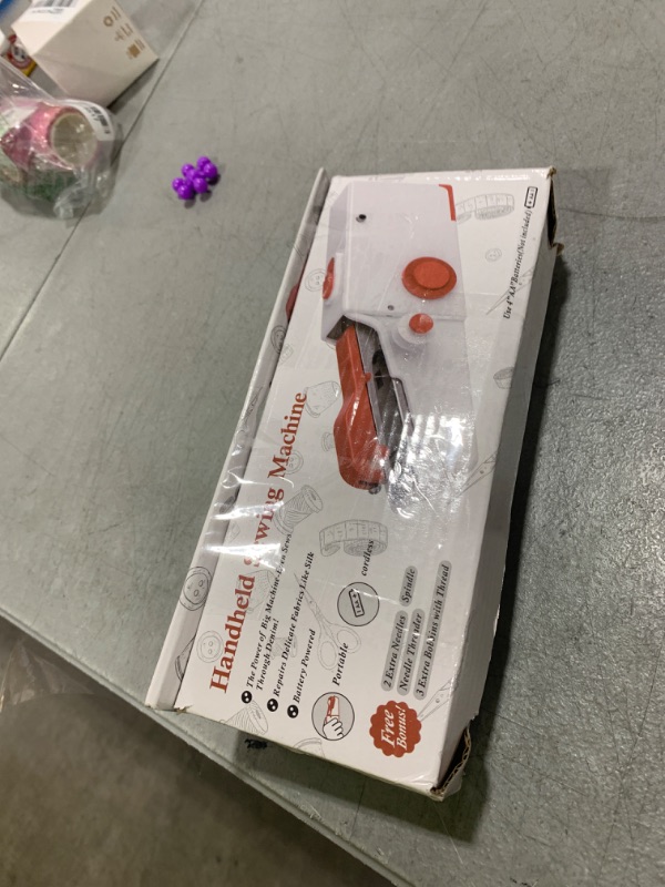 Photo 1 of Portable Handheld Sewing Machine, Quick Sew Mini Electric Sewing Machine, Easy-to-Use for Beginners, Adults, Clothes Mending, Family Travel & DIY Essentials