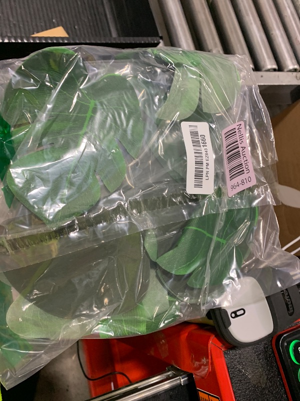 Photo 1 of 100Pcs Palm Leaves Artificial Tropical Monstera Plant Fake Leaves Safari Birthday Decorations,Jungle Theme Party Supplies,Faux Green Leaf for Hawaiian Luau Tiki Aloha Beach BBQ Table Decoration 3 Size