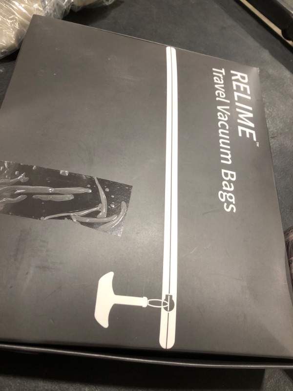 Photo 1 of Relime Vacuum Bags for Travel Luggage with Wireless Pump, Revolutionary Reusable Compression Bags for Carry On Suitcases and Backpack, Vacuum Seal Packing cube for Cloth Packing (2PC + PUMP)