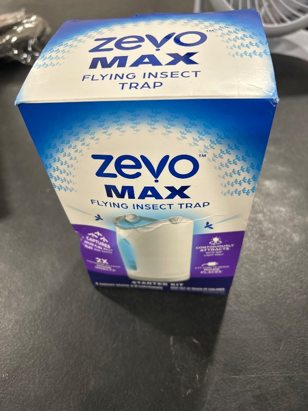 Photo 1 of Zevo MAX Bug Catcher & Fly Trap for Indoors - Flying Insect Trap for Gnats, House & Fruit Flies - Use in Any Room - No-Mess Disposal (1 Plug in Base & 2 Cartridges)