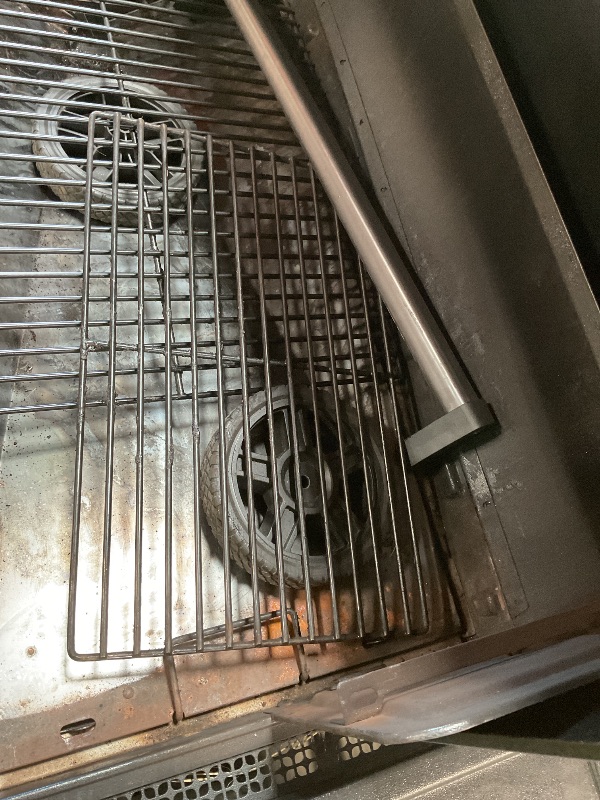 Photo 1 of ** some parts need assembly. Missing hardware for wheels. Brake on one of the wheels is broken.**Traeger Woodridge Pro Wood Pellet Grill & Smoker