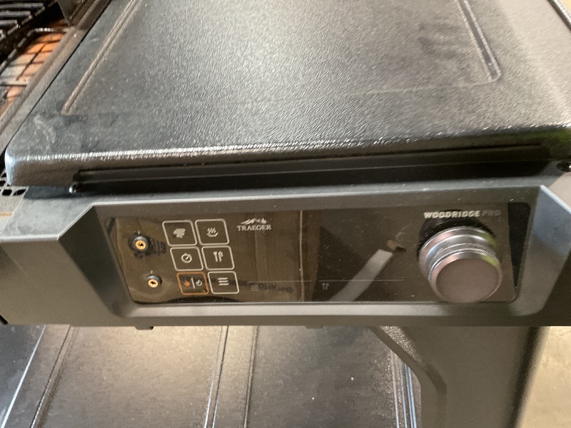Photo 1 of ** some parts need assembly. Missing hardware for wheels. Brake on one of the wheels is broken.**Traeger Woodridge Pro Wood Pellet Grill & Smoker