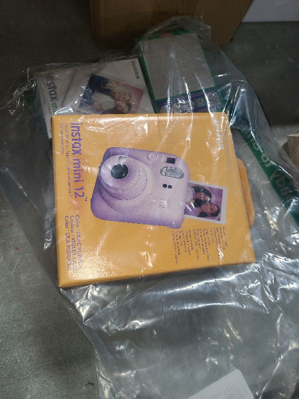 Photo 1 of Fujifilm Instax Mini 12 Camera with Fujifilm Instant Mini Film (60 Sheets) Bundle with Deals Number One Accessories Including Carrying Case, Photo Album, Stickers (Lilac Purple)