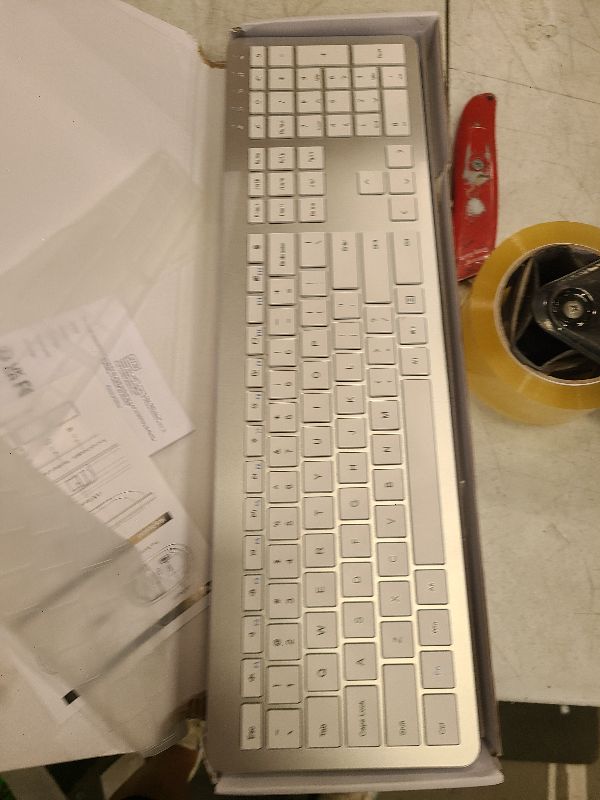 Photo 1 of Wireless Keyboard and Mouse Combo - Full Size Slim Thin Wireless Keyboard Mouse with Numeric Keypad 2.4G Stable Connection Adjustable DPI (White & Silver)