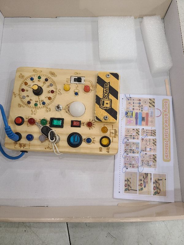 Photo 1 of 23 in 1 Busy Board Montessori Toys for 1-3 Year Old Wooden Learning Educational Toys for Toddlers with 15 Switches, 26 LED Lights, Music Boxes, Locks,Zippers Toddler Sensory Toys for Soothing A Baby