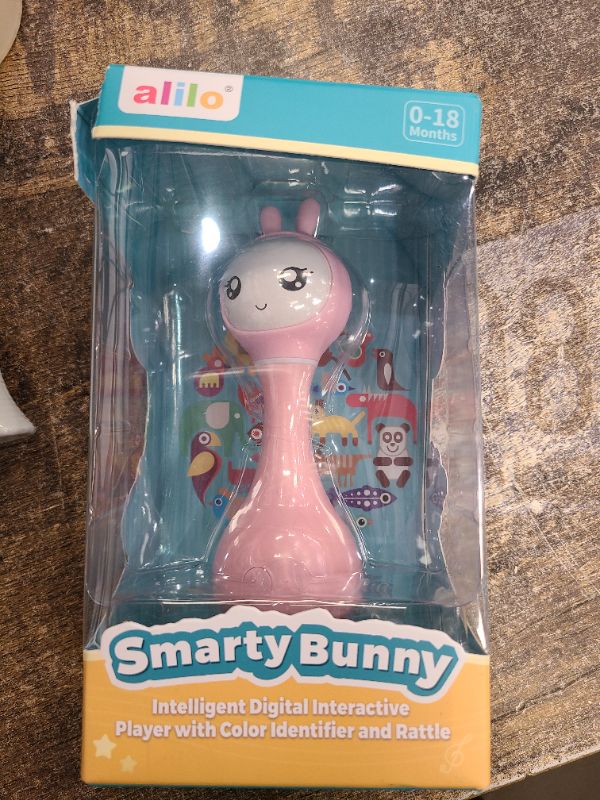Photo 1 of alilo Smarty Bunny Baby Rattle Musical Light Up Toys, Infants Newborns Baby Toys 0-3-6-12-18-24 Months,1 Year Old Boy Girl Easter Gifts, 4 Music Modes and Color Recognition Function with 9 Color Card